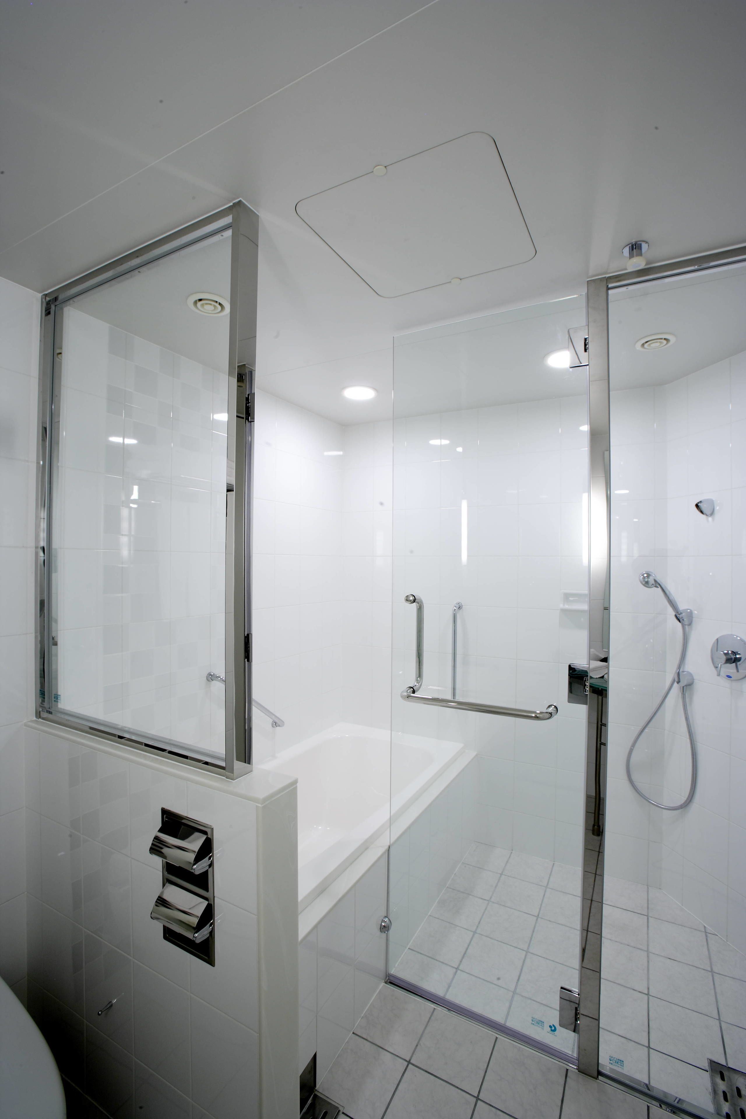 separate bathtub and shower, hair dryer, slippers, electronic bidet