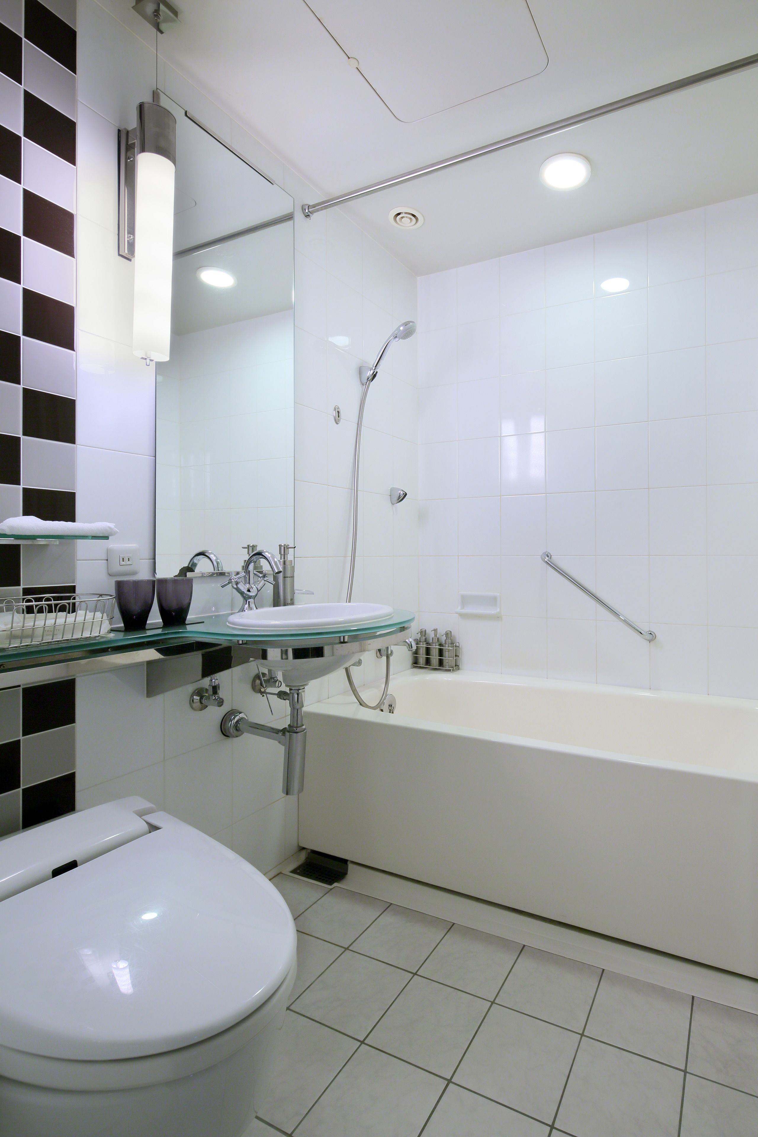 separate bathtub and shower, hair dryer, slippers, electronic bidet