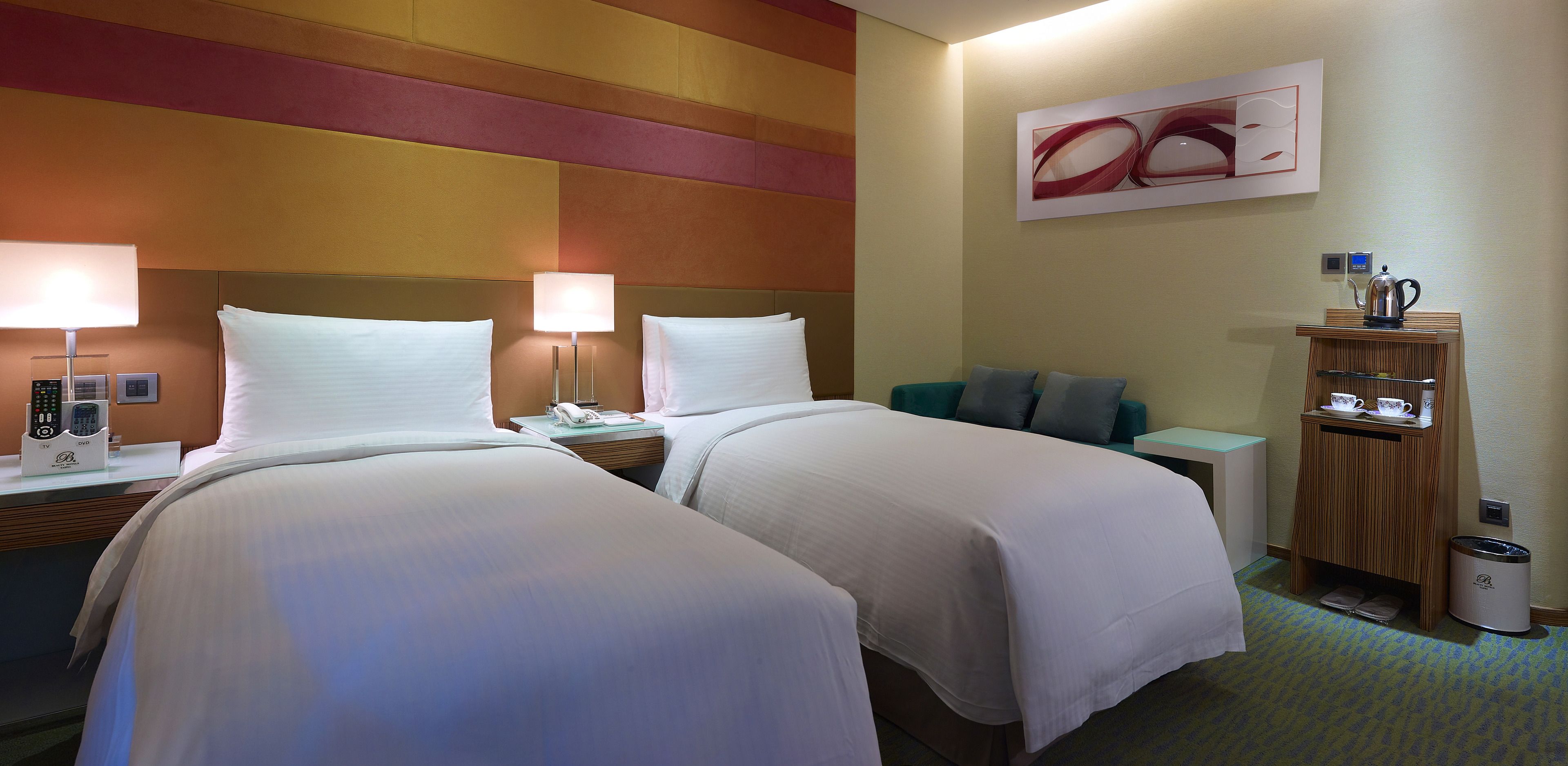 deluxe double or twin room | free minibar, in-room safe, desk, iron/ironing board