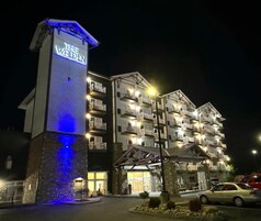 A multi-story hotel with a prominent sign reading "THE WILDEN" at the entrance.