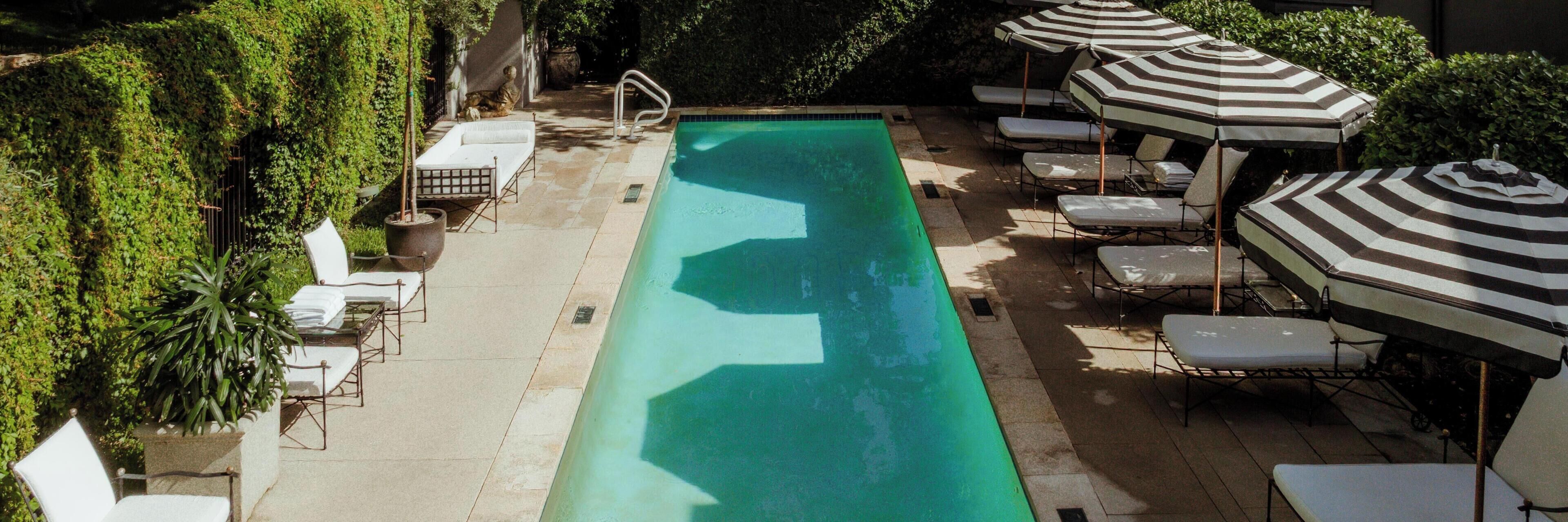 Outdoor pool, pool umbrellas, sun loungers