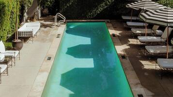 Outdoor pool, pool umbrellas, sun loungers