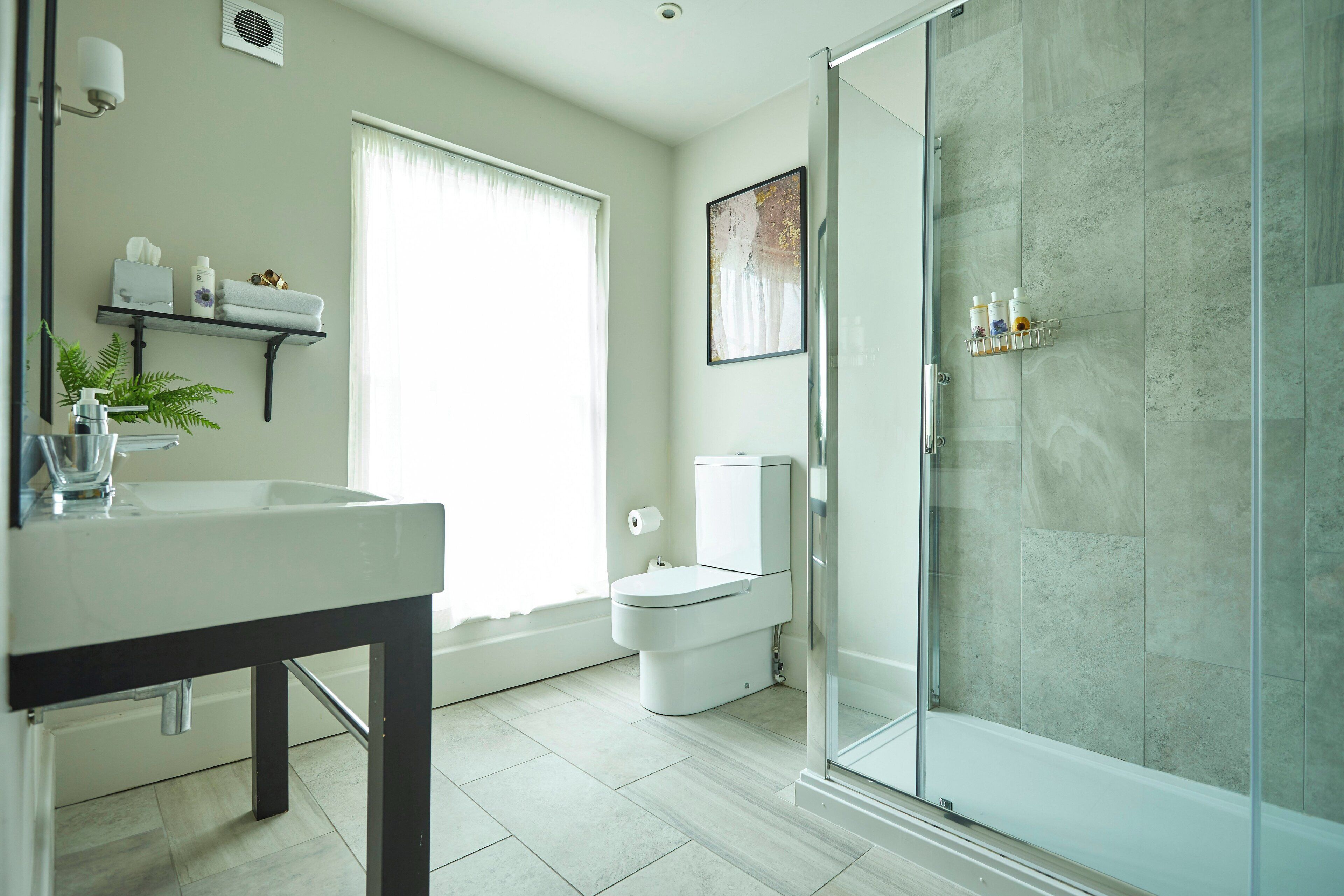 Shower, rainfall showerhead, designer toiletries, towels
