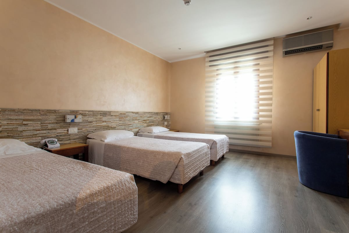 Triple Room | Minibar, in-room safe, desk, soundproofing