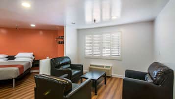 Deluxe Suite, 1 King Bed, Non Smoking, Refrigerator & Microwave | Pillowtop beds, individually furnished, desk, iron/ironing board