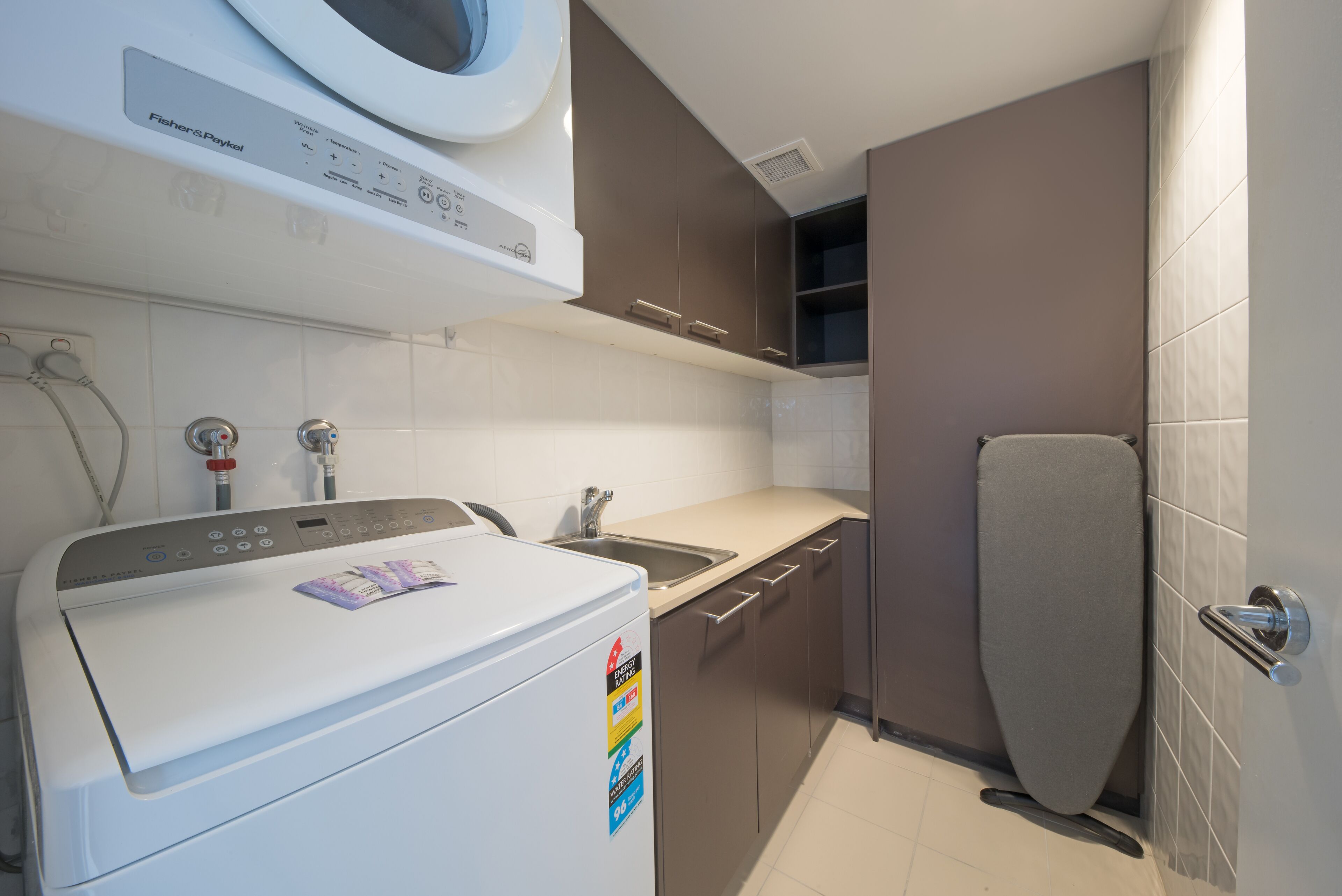 four bedroom two level top floor luxe spa penthouse | laundry