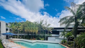 Outdoor pool, pool umbrellas, sun loungers