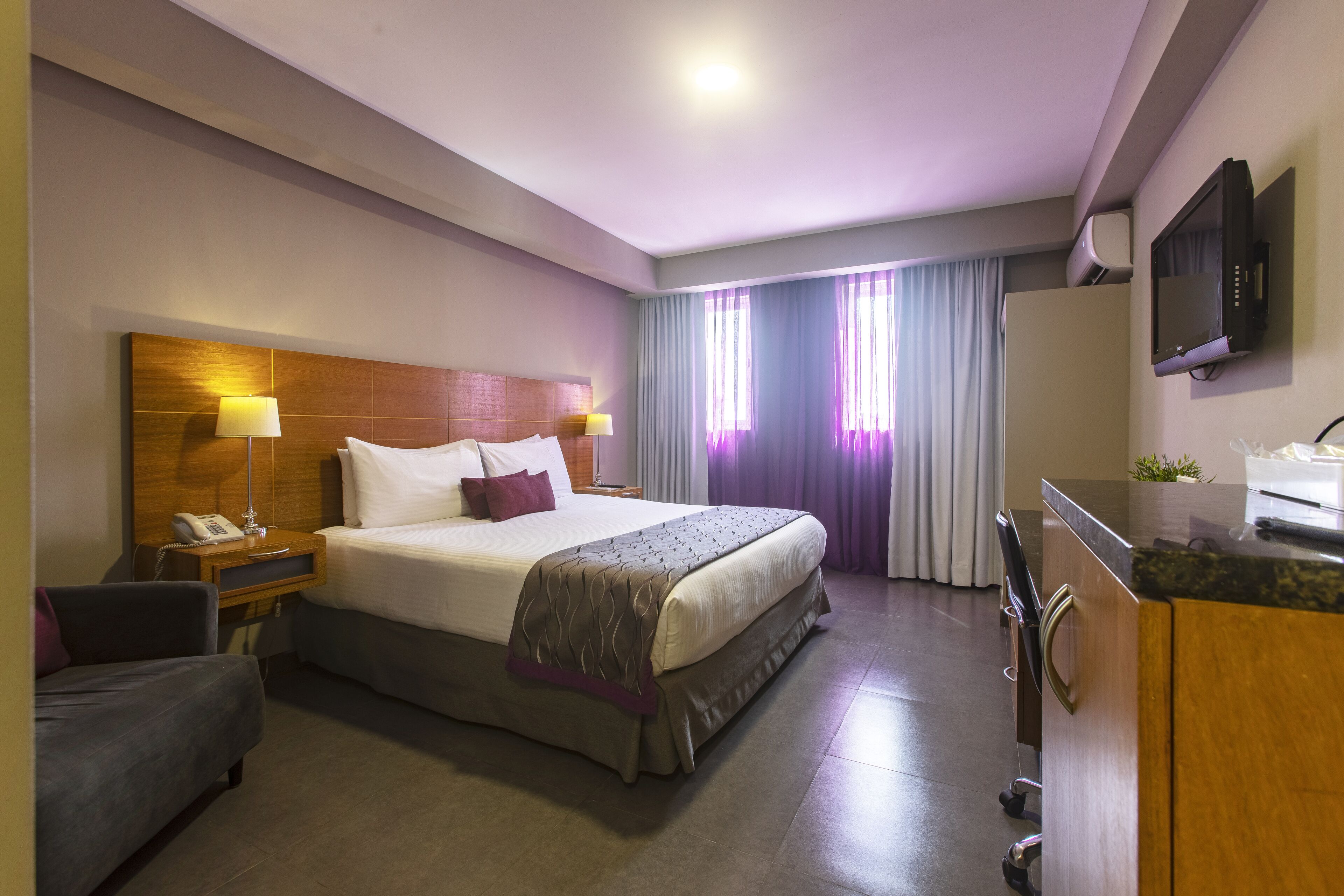 deluxe room | in-room safe, individually decorated, individually furnished, desk