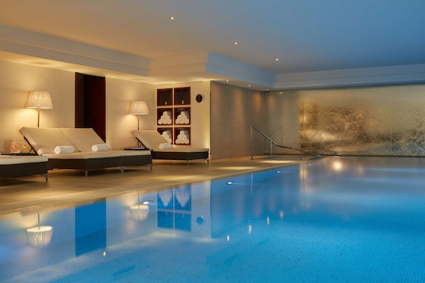 Indoor pool, open 8:00 AM to 9:00 PM, pool loungers