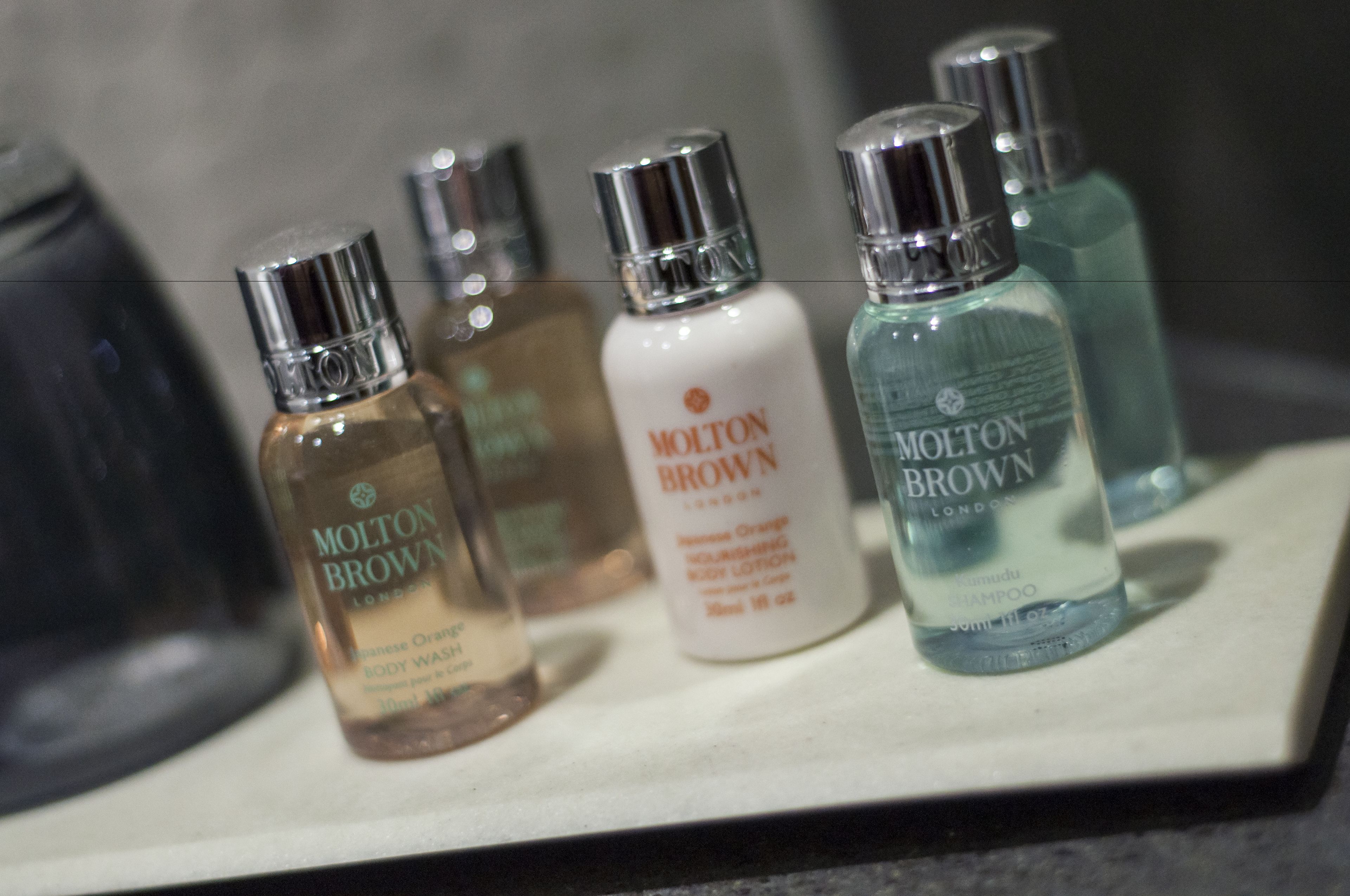 combined shower/bathtub, designer toiletries, hair dryer, towels