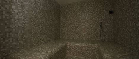 A pixelated room with a bench and a shower area.