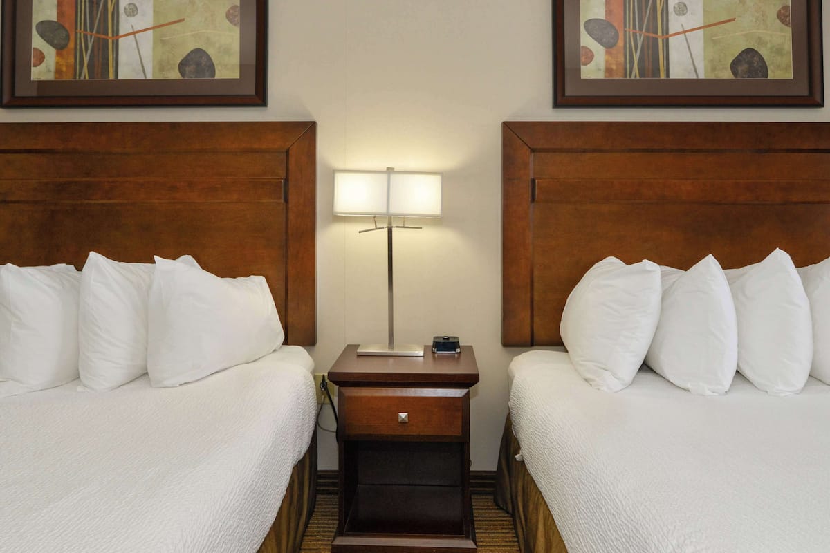 room, 2 queen beds (coast) | desk, laptop workspace, iron/ironing board, free cots/infant beds