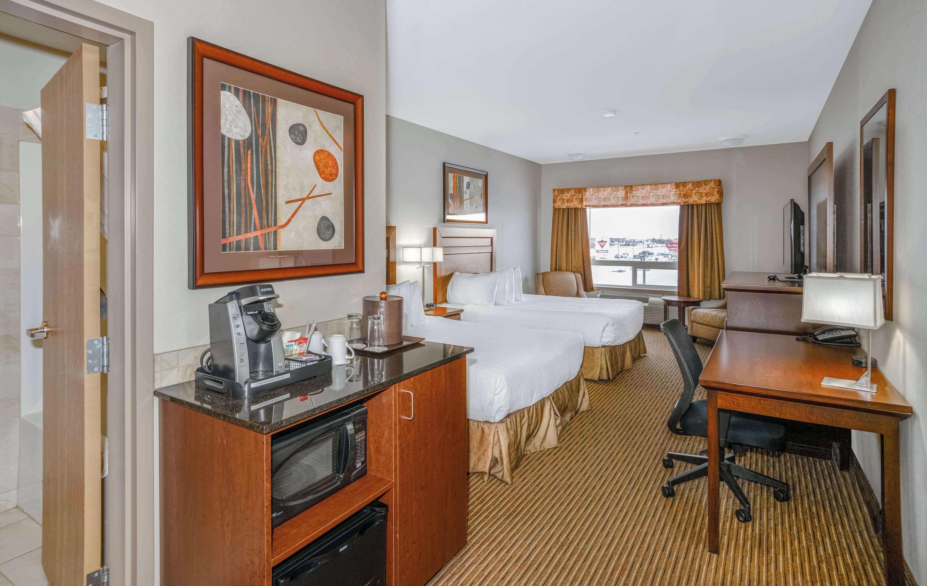 room, 2 queen beds (coast) | desk, laptop workspace, iron/ironing board, free cots/infant beds