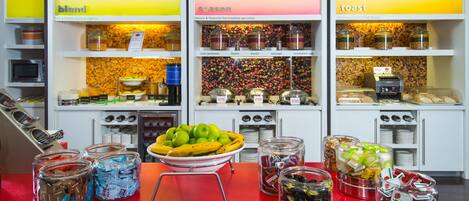 A buffet area with labeled sections for 'blend', 'season', and 'toast'. There are various food items and condiments available.