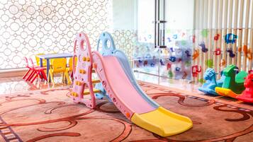 Kids can play on the colorful slide and enjoy the fun play area.