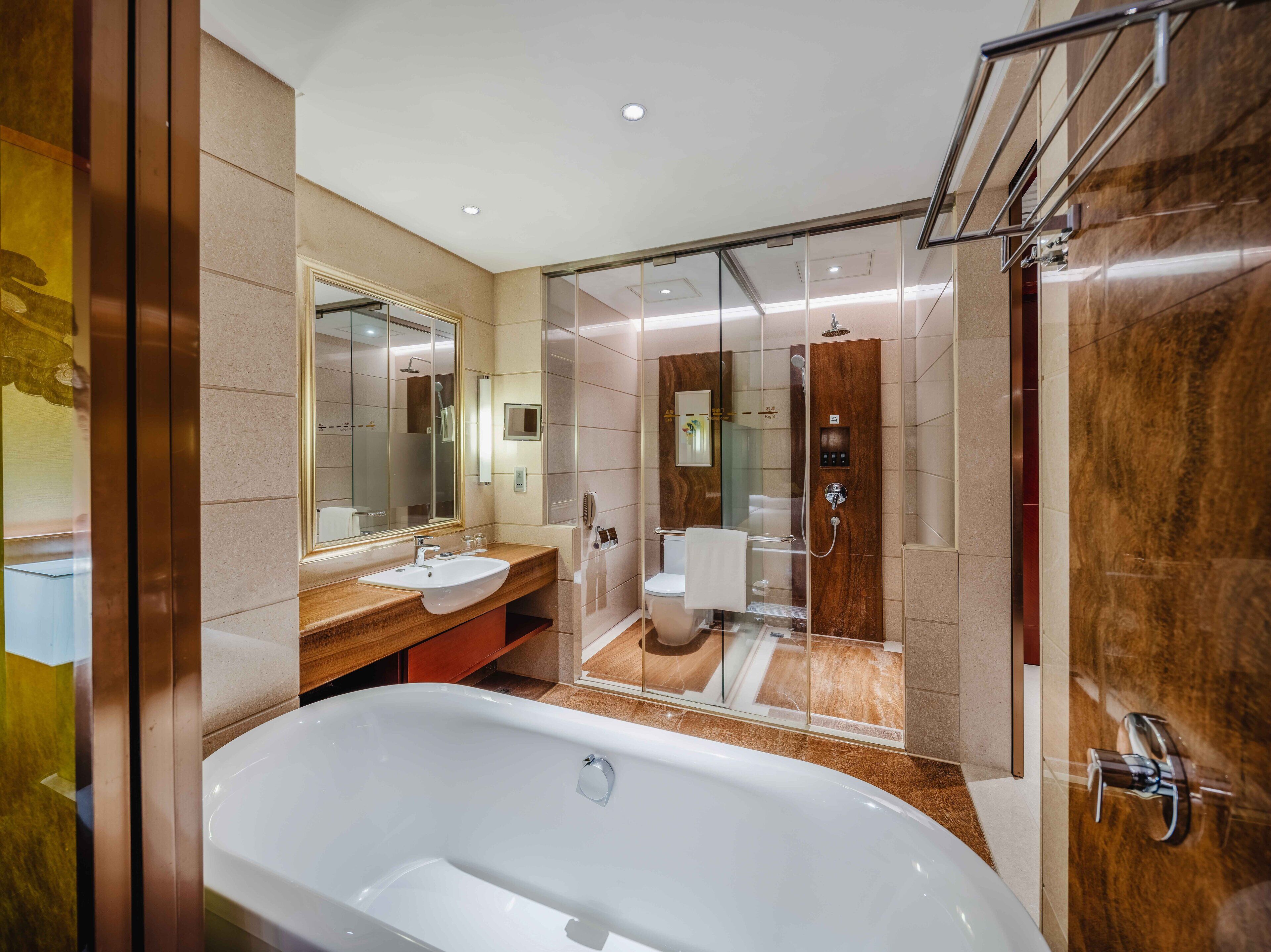 separate bathtub and shower, deep-soaking bathtub, rainfall showerhead