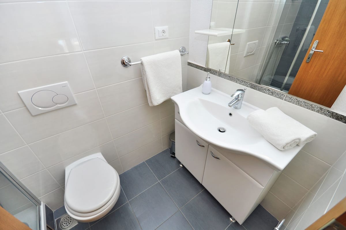 double room | bathroom | hair dryer, towels, soap, toilet paper