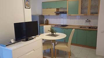 Standard Apartment, 1 Bedroom, Sea View | Private kitchen | Fridge, coffee/tea maker