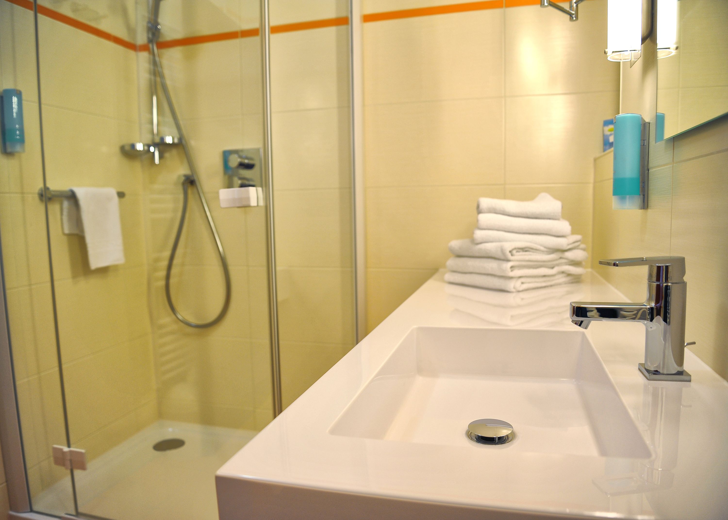 family room | bathroom | shower, free toiletries, hair dryer, towels