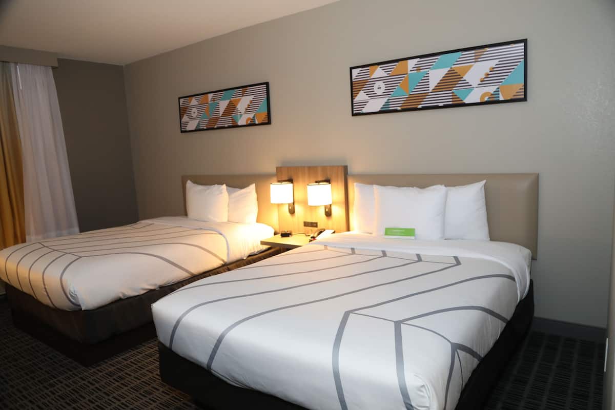 deluxe room, 2 double beds, non smoking | premium bedding, desk, laptop workspace, blackout curtains