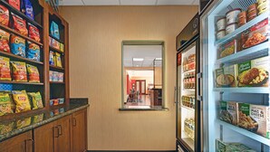 A grocery aisle with snack and frozen food sections. - Hampton Inn Lordsburg (Lordsburg)