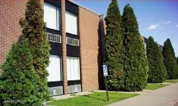 A two-story building with a brick facade and large windows.