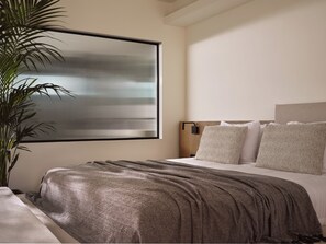 Suite superior, bañera de hidromasaje | Minibar, caja fuerte, cortinas opacas y sistema de insonorización