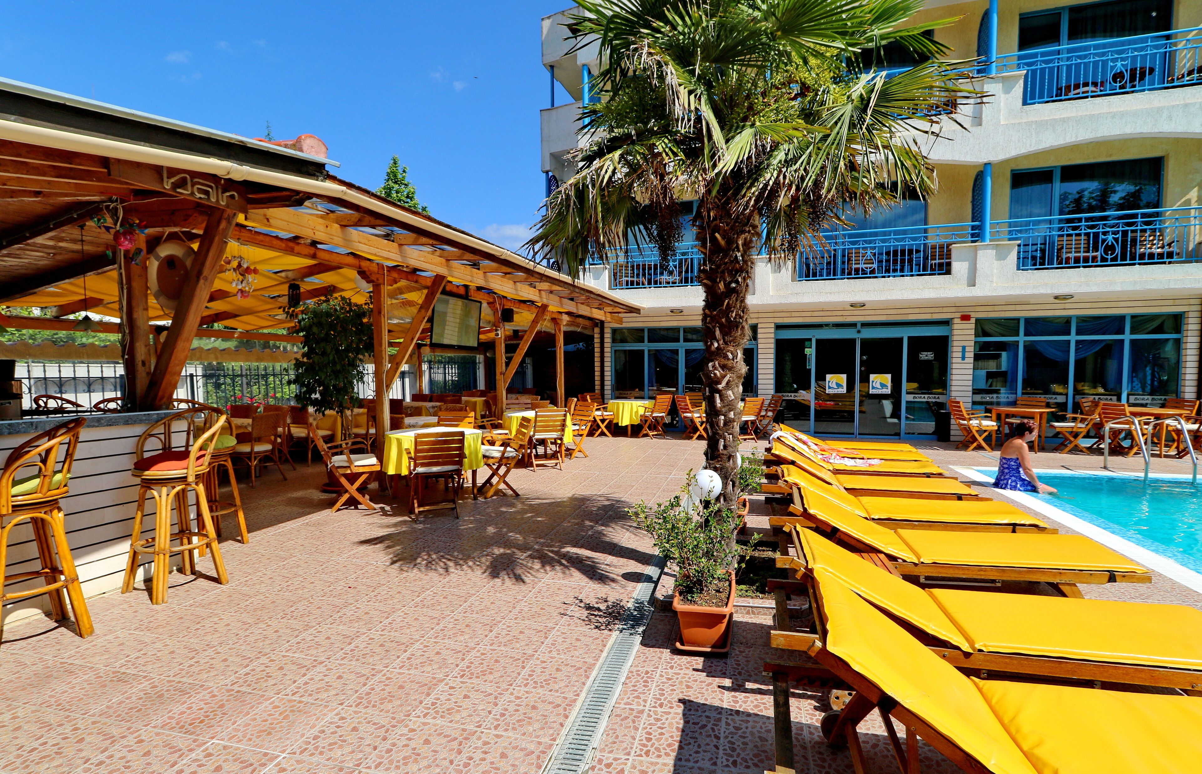 outdoor pool, pool umbrellas, pool loungers