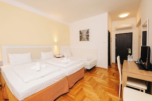 Standard Triple Room | 1 bedroom, in-room safe, desk, blackout drapes