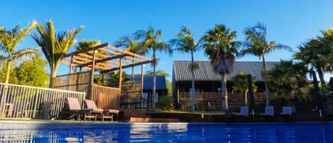 Outdoor pool, pool umbrellas, sun loungers