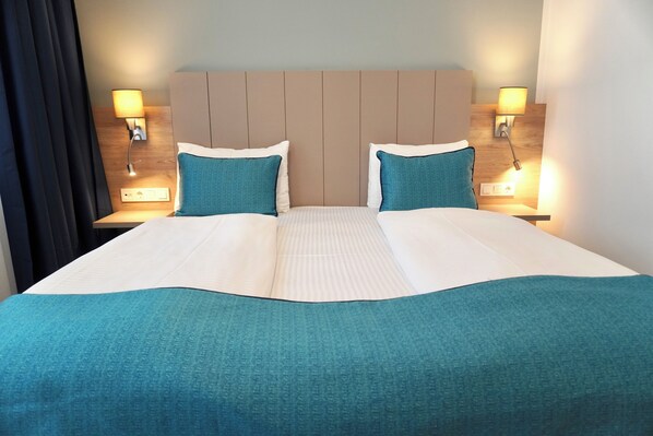 Premium bedding, down duvets, Select Comfort beds, minibar