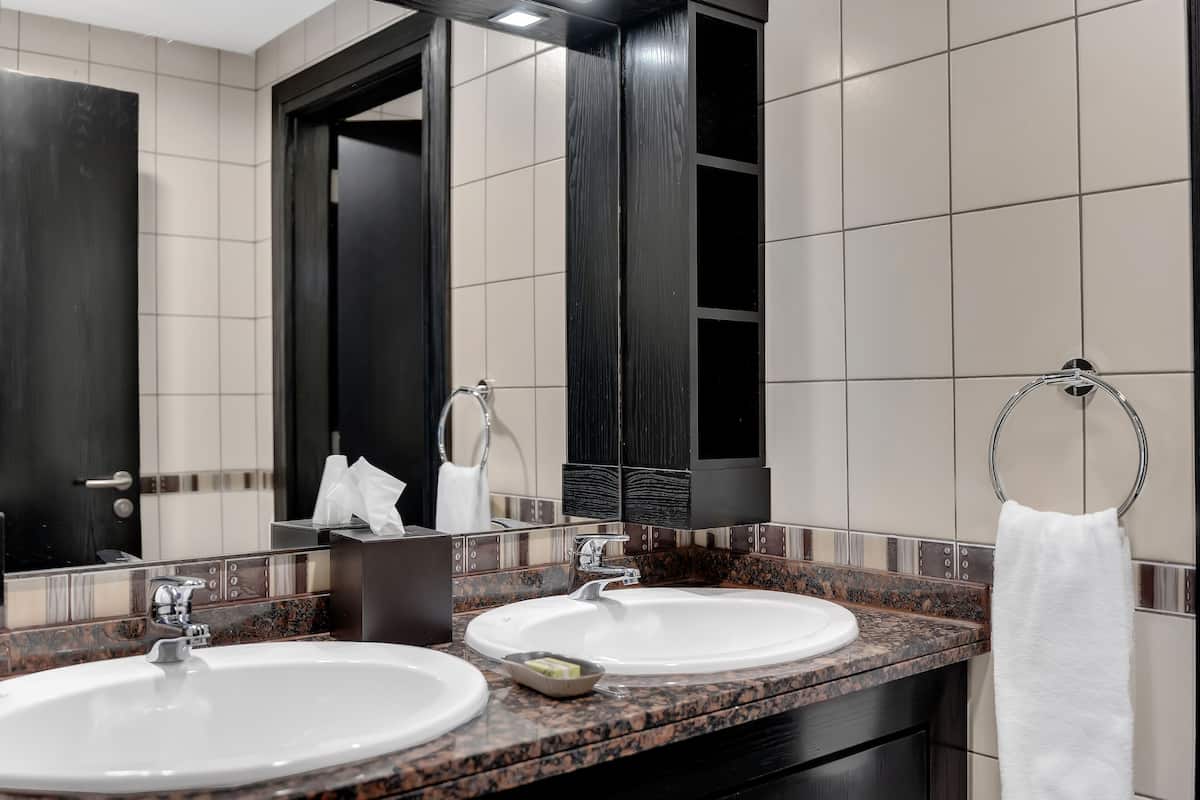 suite, multiple beds, city view (superior four bedroom) | bathroom | combined shower/bathtub, rainfall showerhead, designer toiletries