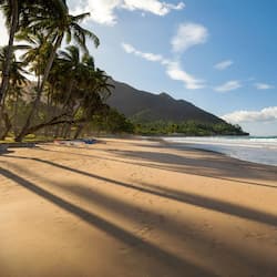 On the beach, white sand, sun-loungers, beach towels