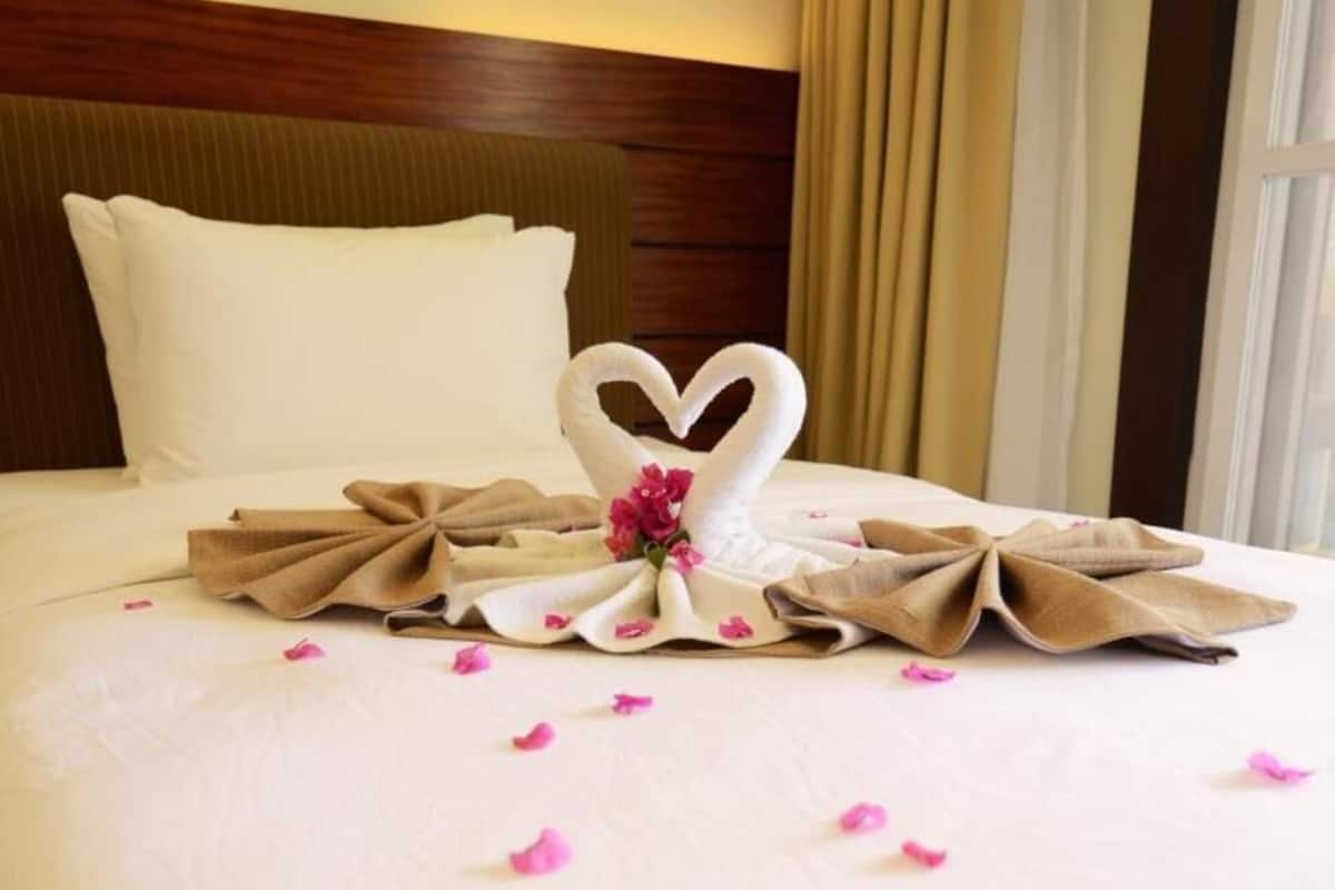 Premium bedding, down duvets, in-room safe, desk