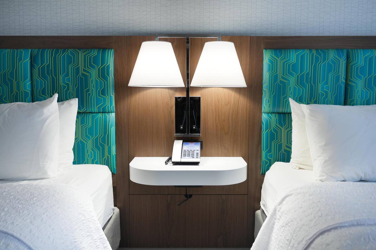 room, 2 queen beds | in-room safe, desk, iron/ironing board, free cots/infant beds