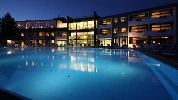 Relax by the pool surrounded by lounge chairs and take in the views from the hotel's multiple levels and balconies.