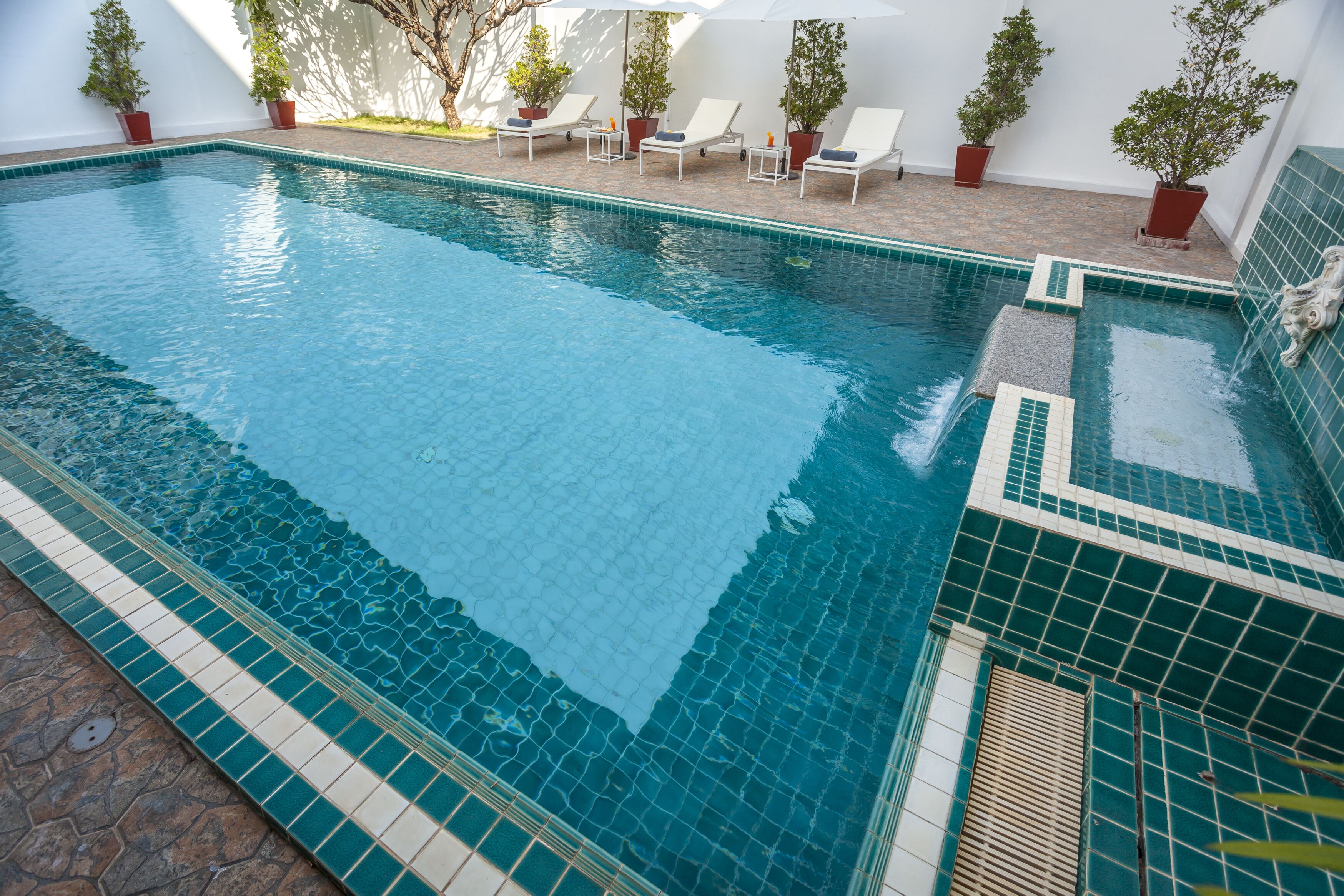 outdoor pool, pool umbrellas, pool loungers