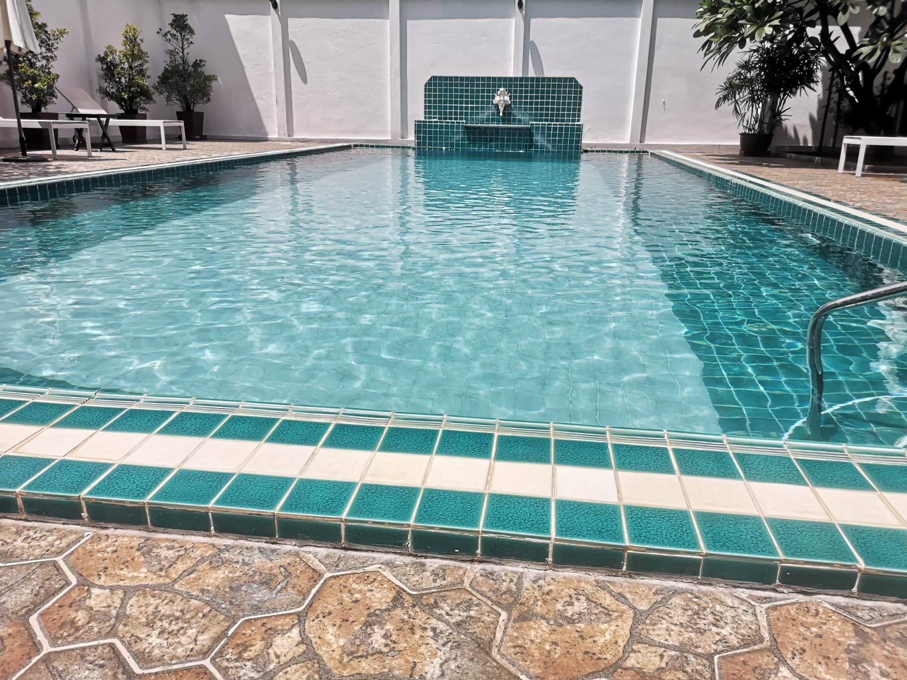 outdoor pool, pool umbrellas, pool loungers