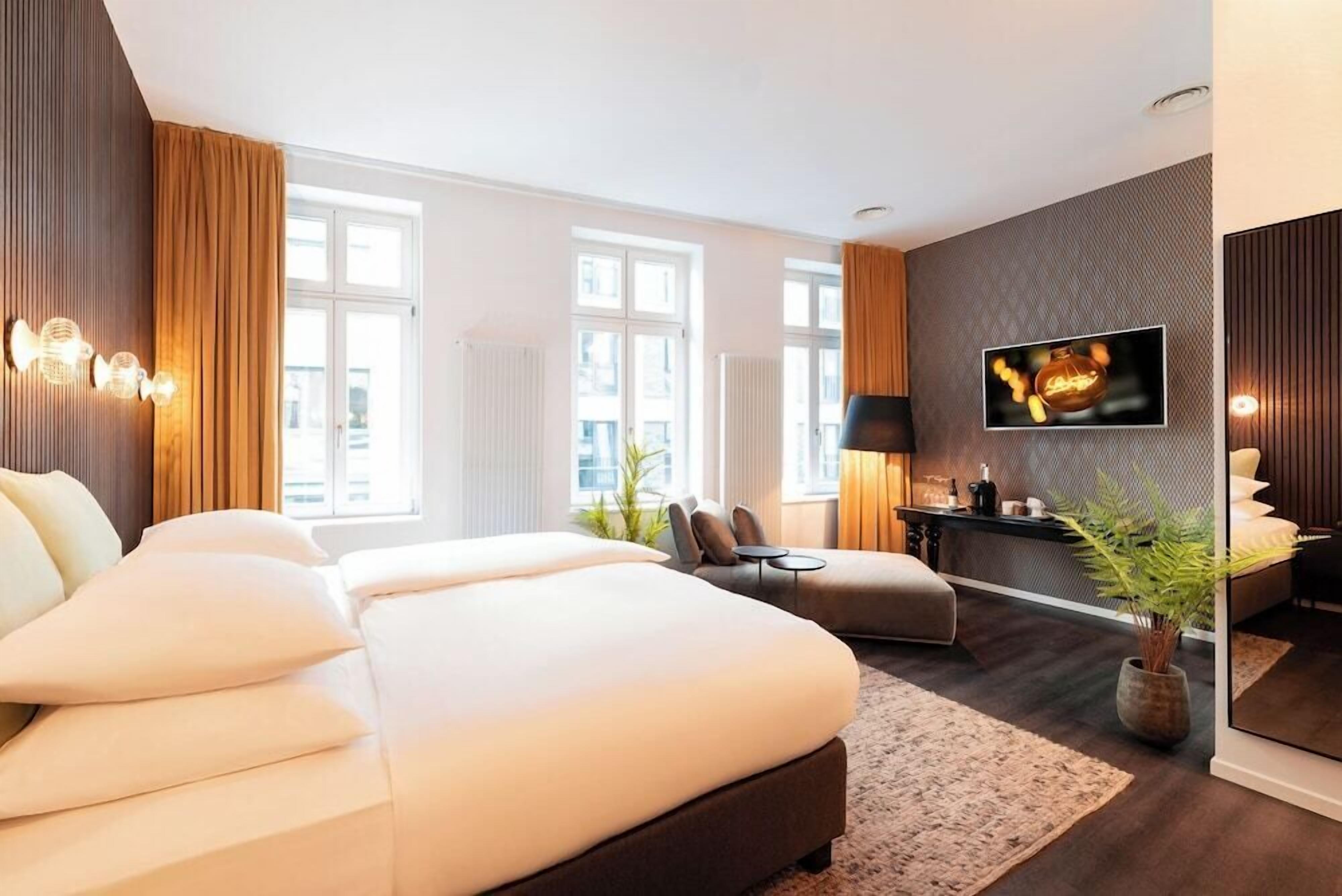 Hypoallergeen beddengoed, een minibar, een kluis op de kamer, een bureau