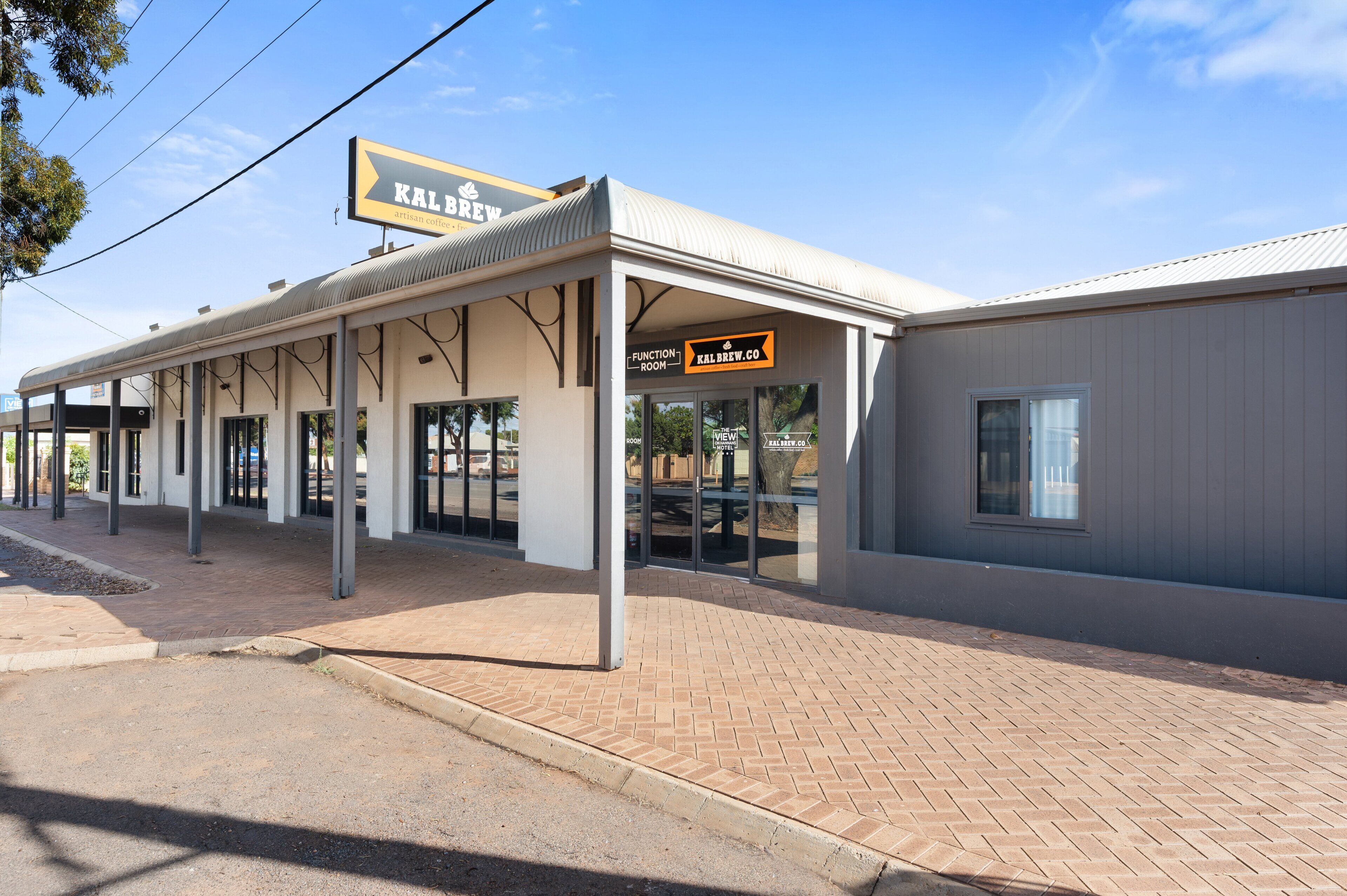A building with a sign reading "KALBREW" and "FUNCTION ROOM."