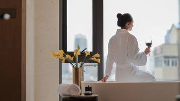 Designer toiletries, hair dryer, bathrobes, slippers