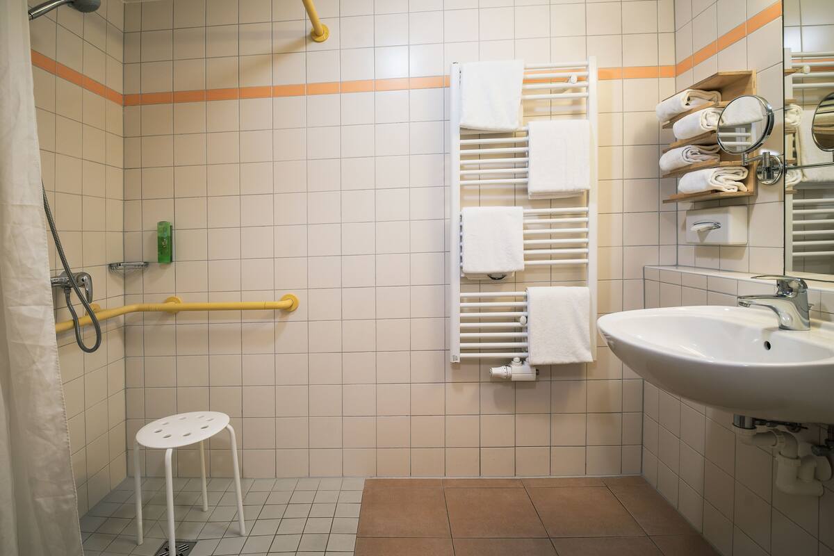 quadruple room | bathroom | shower, hair dryer, towels