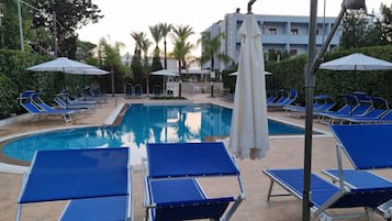 Outdoor pool, open 9:30 AM to 7:30 PM, pool umbrellas, pool loungers
