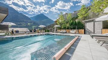 Indoor pool, pool umbrellas, pool loungers