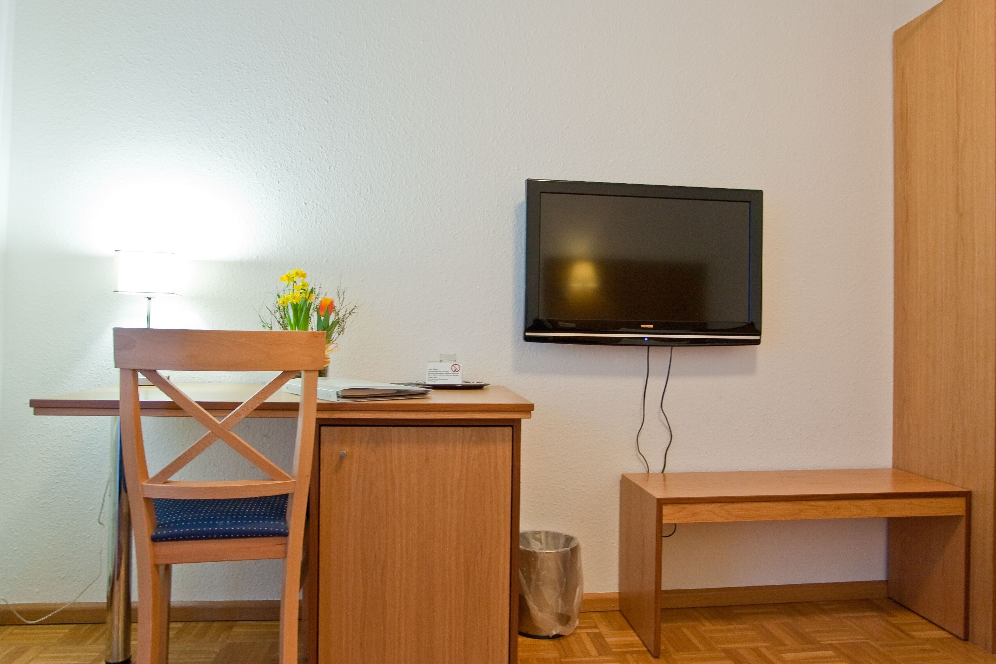 single room | premium bedding, desk, blackout curtains, iron/ironing board