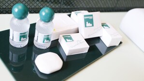 A tray with bottles of Dove soap and boxes of soap.