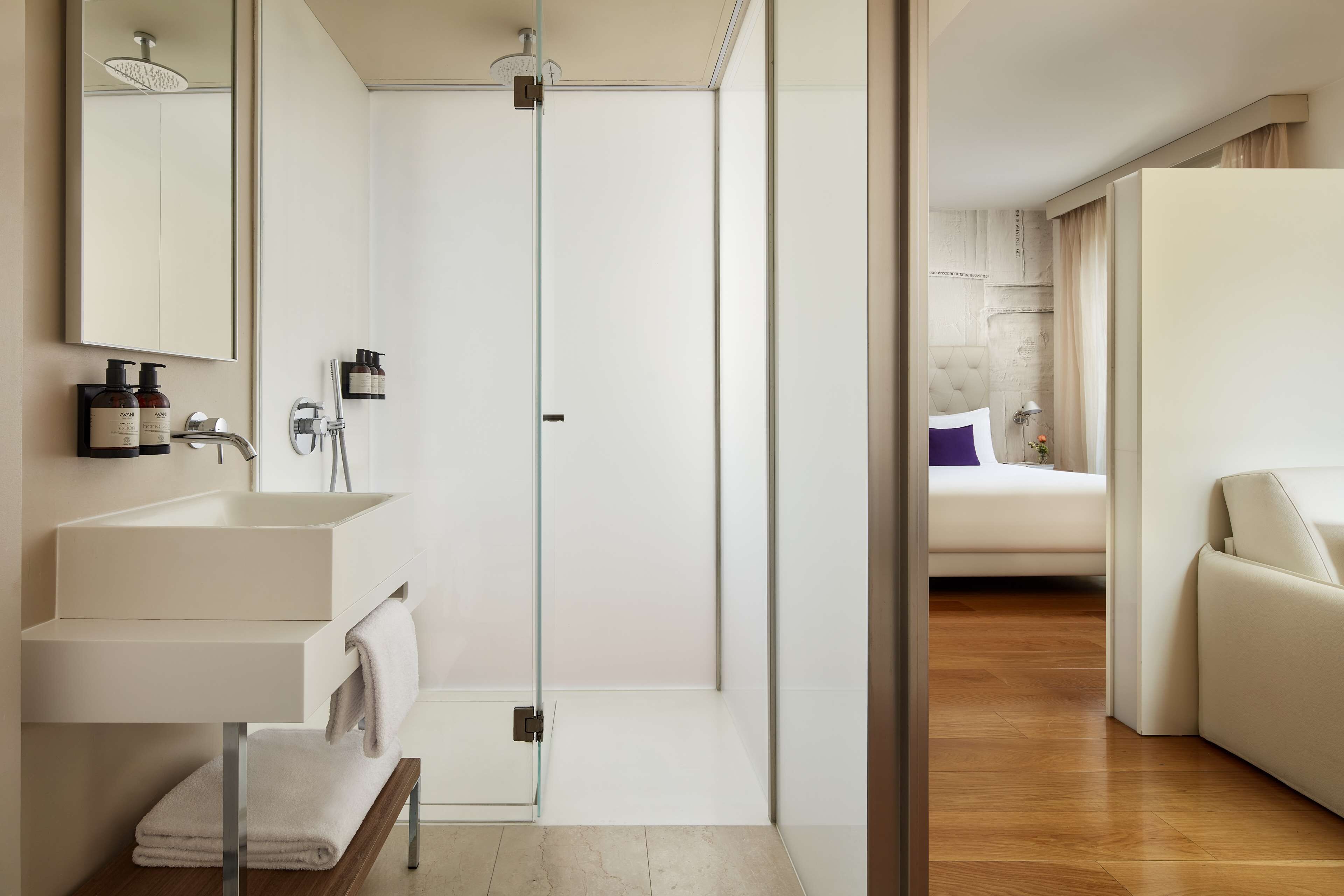 junior suite (avani) | bathroom | shower, eco-friendly toiletries, hair dryer, towels