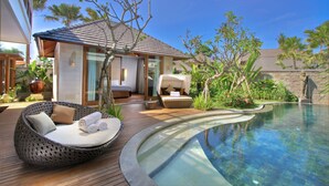 A modern resort with a swimming pool, outdoor seating, and lush landscaping. - The Akasha Seminyak Bali Luxury Villas (Seminyak)