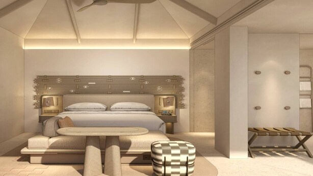A modern bedroom with a large bed, bedside tables, a small round table, and a bench. - Nivata Koh Samui, Tapestry Collection by Hilton (Koh Samui)