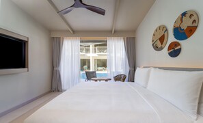 A hotel room with a bed, a TV, a ceiling fan, and a view of a pool and balcony. - Nivata Koh Samui, Tapestry Collection by Hilton (Koh Samui)
